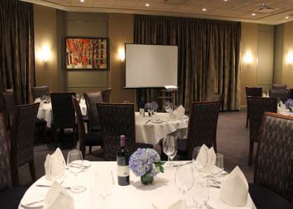 When combined, the Arlington & Chestnut rooms seat 60 with crescent tables facing a projector screen