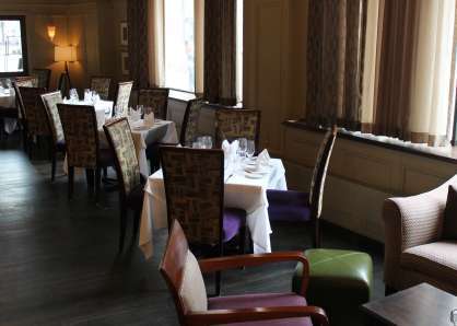 The lounge can be set with square tables for four for a la carte dining