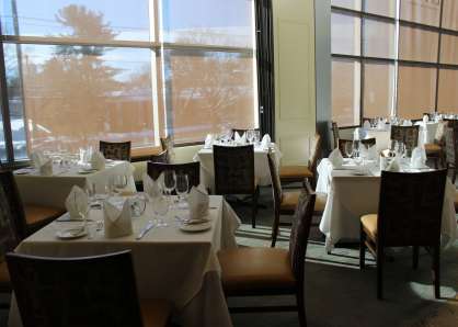 The semi-private Newbury Room can be set up with small square table for a seated capacity of 16