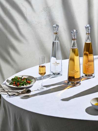 Four Cincoro Tequila Bottles, salad and pasta