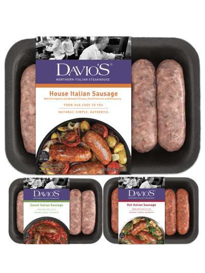 Three packages of Davio's sausage: House Italian, Sweet Italian, and Hot Italian. Each package has a label featuring a photo of the sausages prepared with other ingredients in a pan, as well as the Davio's logo and a black and white photo of Davio's chefs working in the kitchen. The uncooked sausages are visible in the part of the package not covered by the wrapping label.