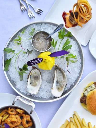 Oysters, calamari, chicken slider, flatbread, bolognese