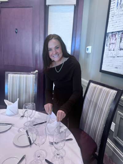 Woman, Long Dark Hair, Adjusting a napkin