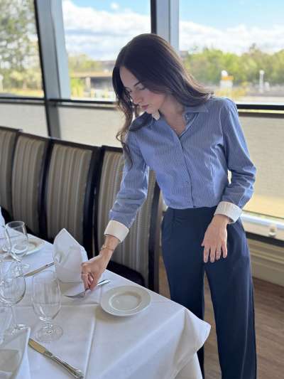 Woman, Long Dark Hari, Blue Shirt, Fixing place settings on a table
