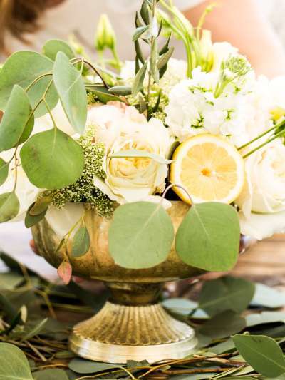 Yellow, white and green flowers arranged in a vase