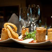 Trio of spring rolls with spicy ketchup and crispy onions