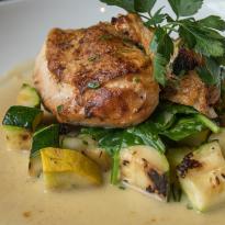 Oven Roasted Chicken, Grilled Zucchini, and Summer Squash, in a Lemon Basil Vinaigrette with Parsley Garnish