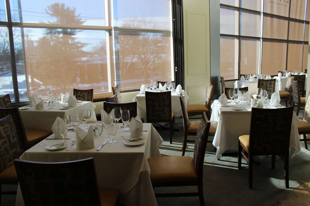 The semi-private Newbury Room can be set up with small square table for a seated capacity of 16