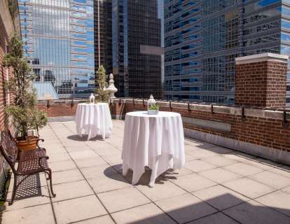 The patio can be set with cocktail tables and boasts a view of the city skyline