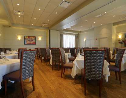 The Newbury and Arlington Rooms, when combined and set with round tables, accommodate up to 70 guests