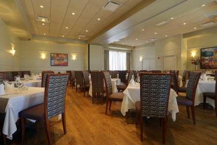 The Newbury and Arlington Rooms, when combined and set with round tables, accommodate up to 70 guests