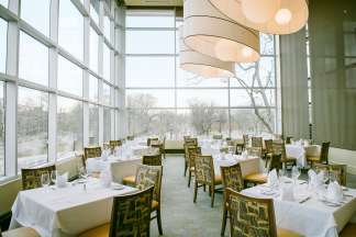Wall-to-wall windows and dramatic lighting fixtures are the hallmarks of this beautiful event space
